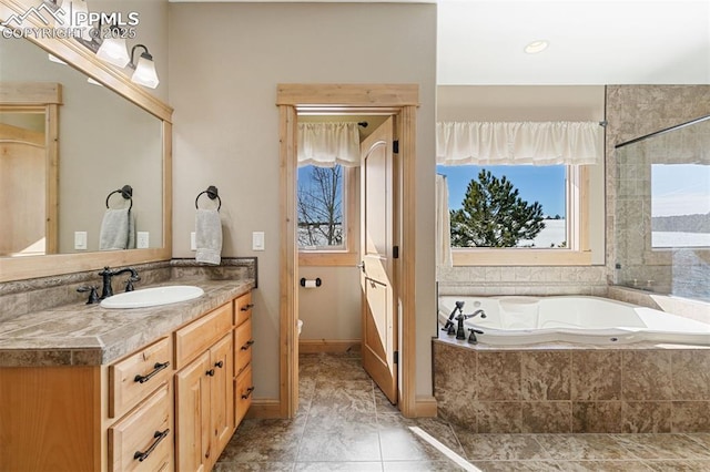 18320 Table Rock Rd, Colorado Springs, CO 80908 - full bathroom with a garden tub, vanity, toilet, and tile patterned flooring