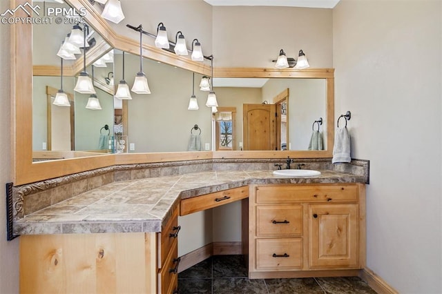 18320 Table Rock Rd, Colorado Springs, CO 80908 - bathroom with vanity and baseboards
