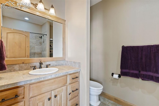 18320 Table Rock Rd, Colorado Springs, CO 80908 - bathroom featuring vanity, toilet, and a shower