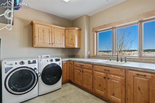 18320 Table Rock Rd, Colorado Springs, CO 80908 - laundry room with washer and clothes dryer and cabinet space