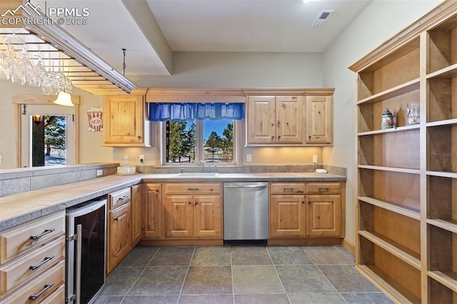 18320 Table Rock Rd, Colorado Springs, CO 80908 - kitchen featuring beverage cooler, dishwasher, a sink, light countertops, and dark stone finish floors