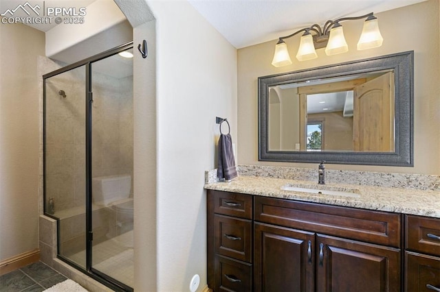 18320 Table Rock Rd, Colorado Springs, CO 80908 - full bathroom featuring vanity, a stall shower, and baseboards