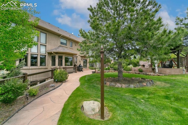18320 Table Rock Rd, Colorado Springs, CO 80908 - view of green lawn featuring a patio
