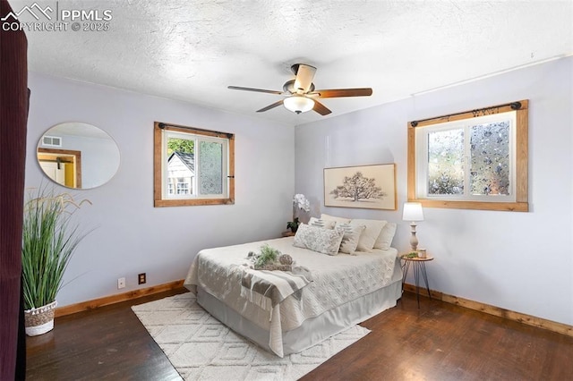1004 Montrose Ave, Colorado Springs, CO 80905 - bedroom with wood finished floors, baseboards, ceiling fan, and a textured ceiling