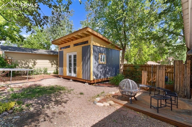 1004 Montrose Ave, Colorado Springs, CO 80905 - view of outbuilding featuring a trampoline and a fire pit