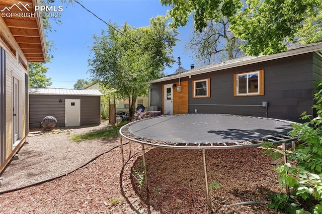 1004 Montrose Ave, Colorado Springs, CO 80905 - rear view of property featuring a trampoline