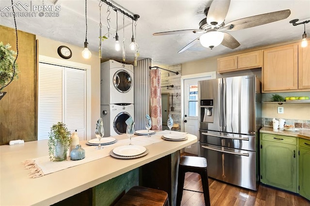 1004 Montrose Ave, Colorado Springs, CO 80905 - kitchen with stainless steel refrigerator with ice dispenser, stacked washer / drying machine, a ceiling fan, and light countertops