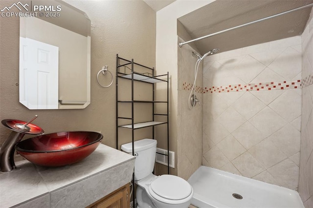 945 Bromefield Dr, Fountain, CO 80817 - full bathroom with vanity, toilet, and a shower stall