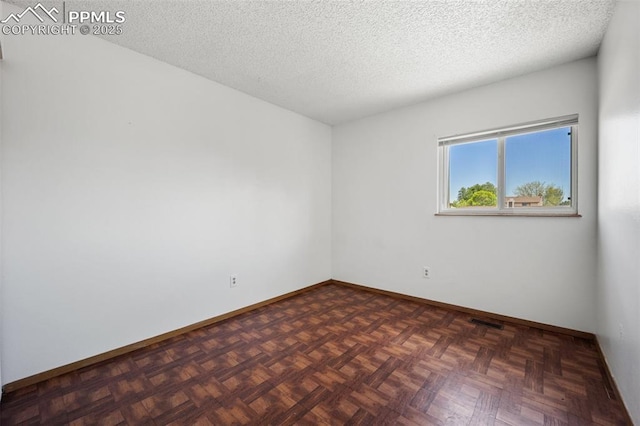 945 Bromefield Dr, Fountain, CO 80817 - spare room with baseboards and a textured ceiling