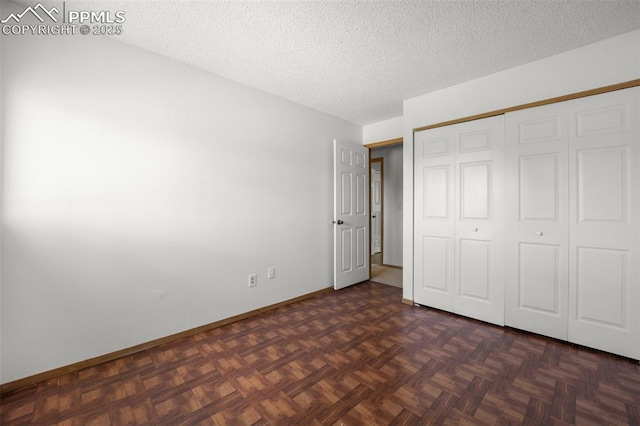 945 Bromefield Dr, Fountain, CO 80817 - unfurnished bedroom featuring a textured ceiling, a closet, and baseboards