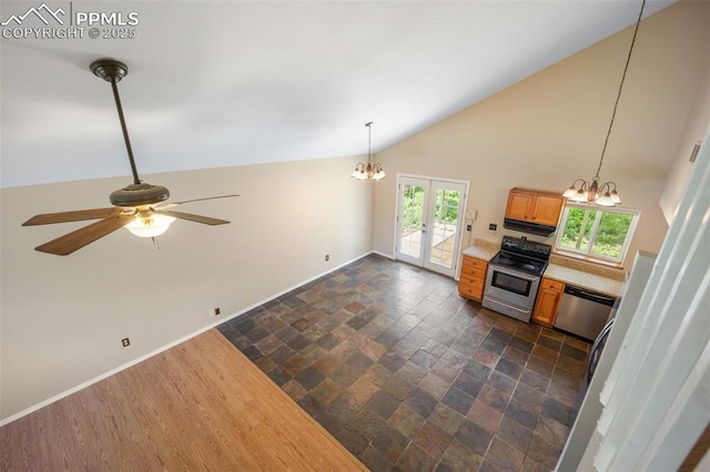 945 Bromefield Dr, Fountain, CO 80817 - kitchen featuring appliances with stainless steel finishes, a chandelier, stone tile floors, a ceiling fan, and baseboards