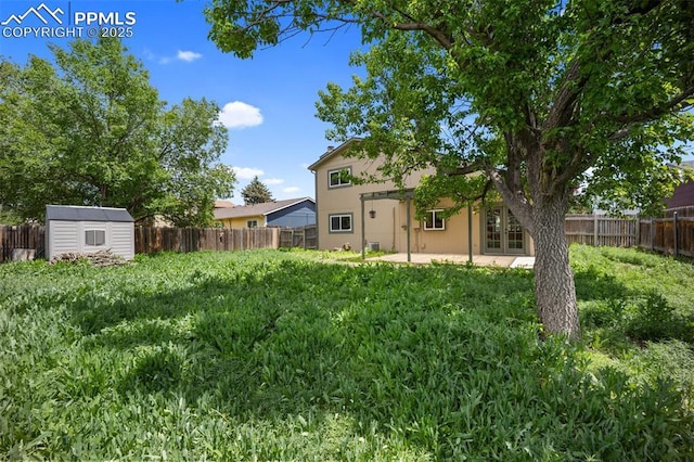945 Bromefield Dr, Fountain, CO 80817 - fenced backyard with french doors and a patio