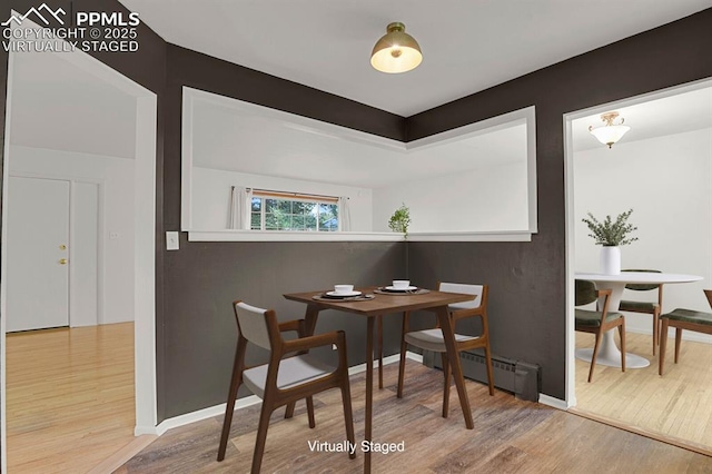2017 Collier Ave, Colorado Springs, CO 80909 - dining room with wood finished floors, baseboard heating, and baseboards
