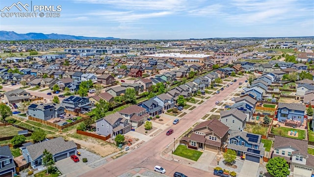 8004 Brittinger Way, Colorado Springs, CO 80951 - aerial view of property and surrounding area with mountains and nearby suburban area
