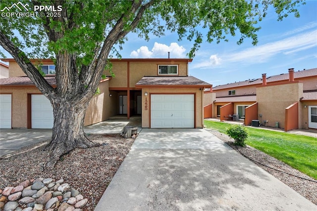 1225 Holland Park Blvd, Colorado Springs, CO 80907 - view of property featuring stucco siding and concrete driveway