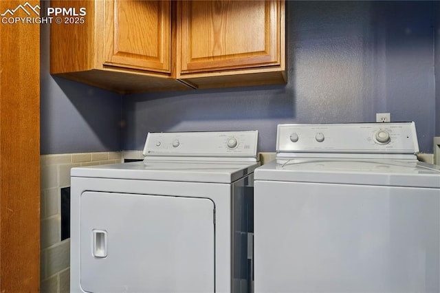 1225 Holland Park Blvd, Colorado Springs, CO 80907 - laundry area with washer and clothes dryer and cabinet space