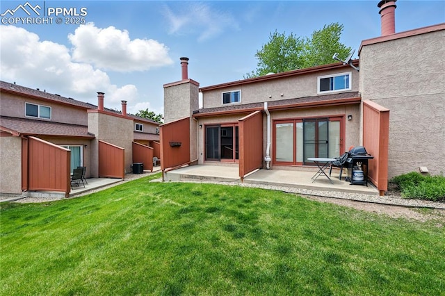 1225 Holland Park Blvd, Colorado Springs, CO 80907 - back of house with a patio and stucco siding