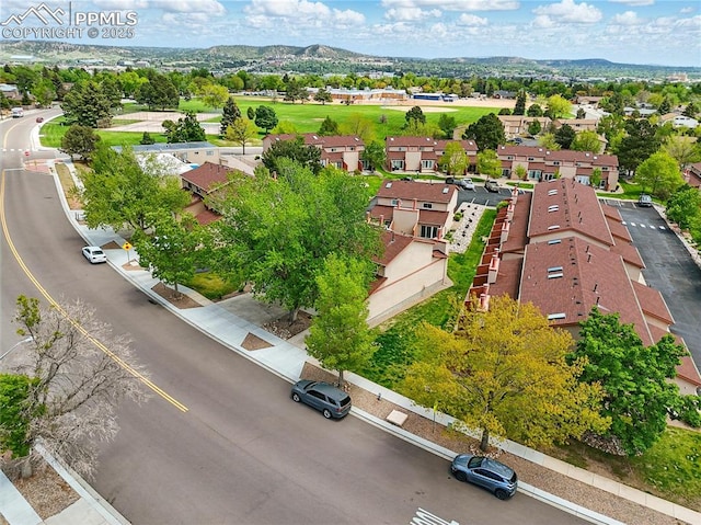 1225 Holland Park Blvd, Colorado Springs, CO 80907 - aerial perspective of suburban area featuring a mountainous background