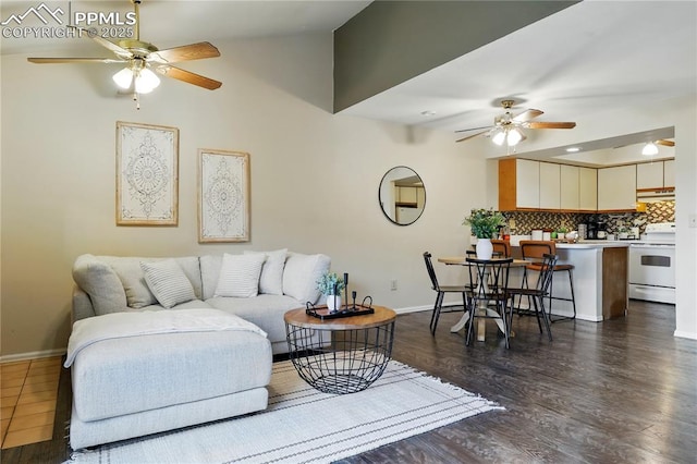 1225 Holland Park Blvd, Colorado Springs, CO 80907 - living room featuring ceiling fan, baseboards, dark wood finished floors, and lofted ceiling