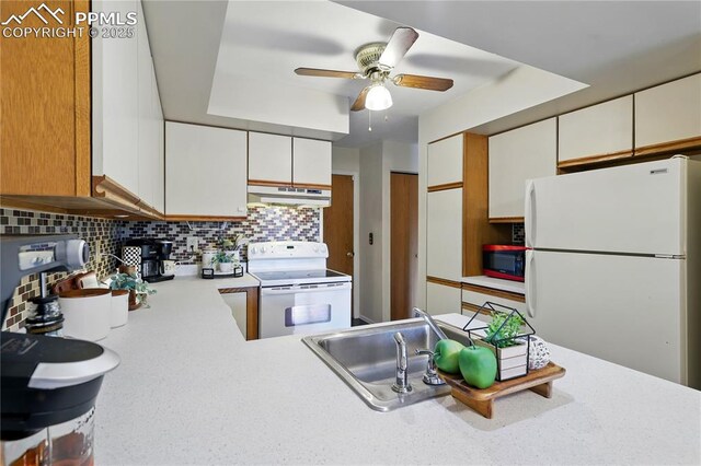 1225 Holland Park Blvd, Colorado Springs, CO 80907 - kitchen featuring white appliances, under cabinet range hood, a sink, ceiling fan, and light countertops