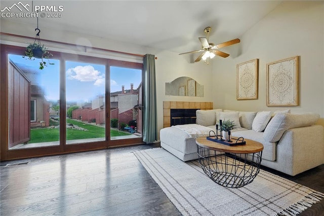 1225 Holland Park Blvd, Colorado Springs, CO 80907 - living room with healthy amount of natural light, a ceiling fan, and wood finished floors