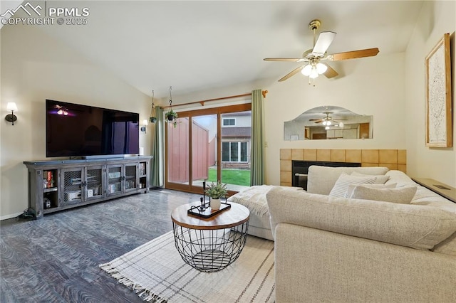 1225 Holland Park Blvd, Colorado Springs, CO 80907 - living room with vaulted ceiling, ceiling fan, wood finished floors, a tile fireplace, and baseboards