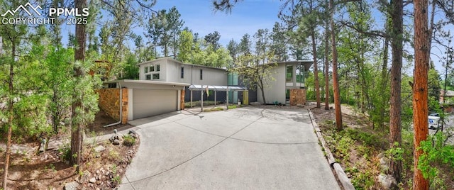 3 Heather Cir, Colorado Springs, CO 80906 - mid-century modern home with driveway and a garage