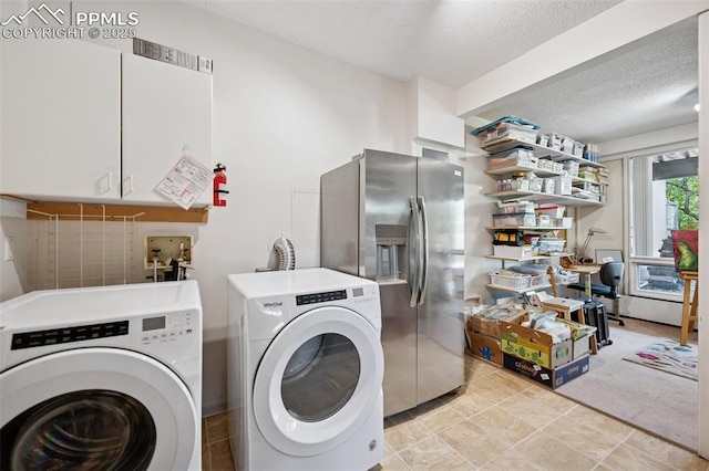 3 Heather Cir, Colorado Springs, CO 80906 - laundry area with washer and dryer, a textured ceiling, and cabinet space
