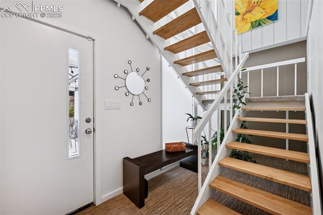 3 Heather Cir, Colorado Springs, CO 80906 - foyer entrance featuring stairway and baseboards