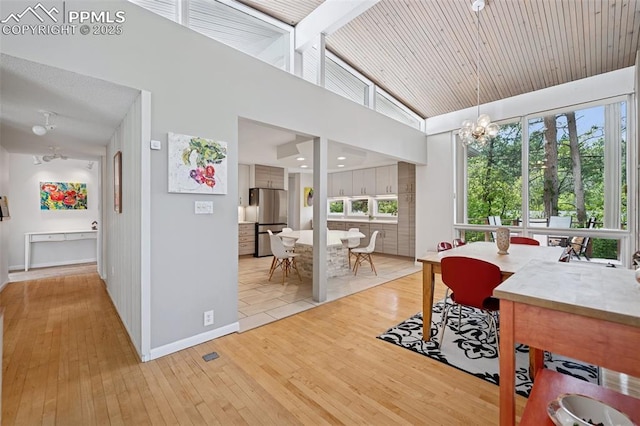 3 Heather Cir, Colorado Springs, CO 80906 - sunroom featuring a chandelier and vaulted ceiling