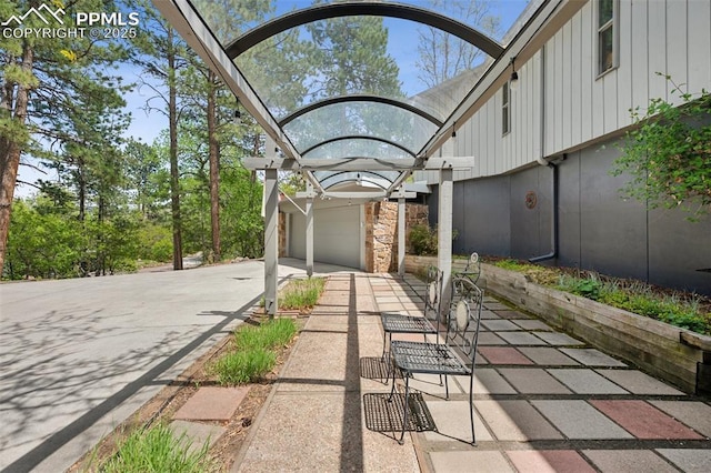 3 Heather Cir, Colorado Springs, CO 80906 - view of patio / terrace with a garage and driveway