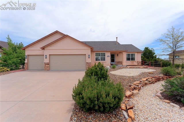 10641 Greenbelt Dr, Peyton, CO 80831 - ranch-style home with stone siding, concrete driveway, a garage, and a shingled roof