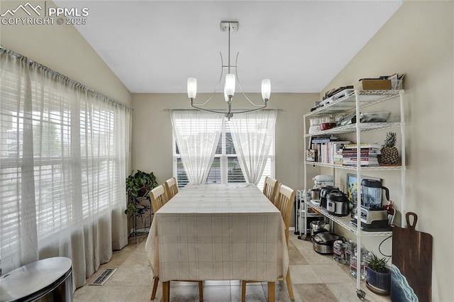 10641 Greenbelt Dr, Peyton, CO 80831 - dining space featuring a chandelier and vaulted ceiling