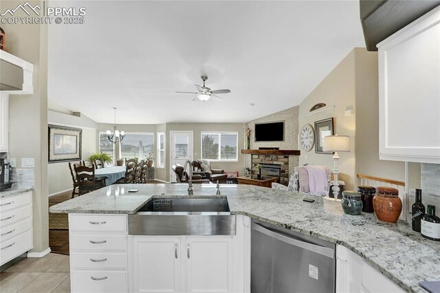 10641 Greenbelt Dr, Peyton, CO 80831 - kitchen featuring dishwasher, a sink, ceiling fan, open floor plan, and white cabinets
