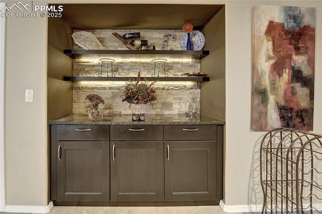 10641 Greenbelt Dr, Peyton, CO 80831 - indoor dry bar with baseboards and decorative backsplash