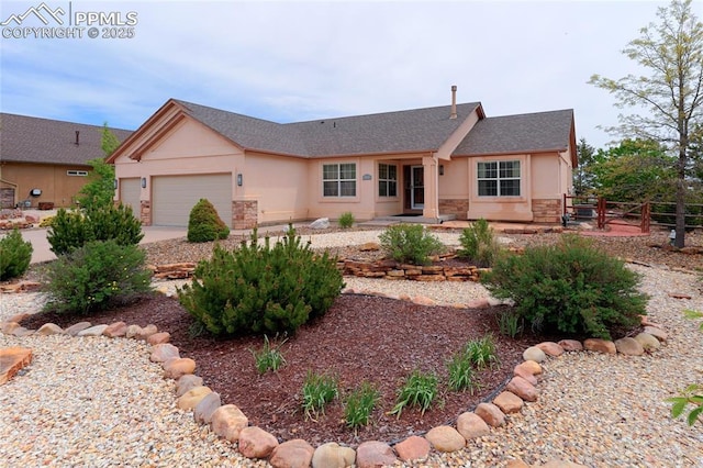 10641 Greenbelt Dr, Peyton, CO 80831 - ranch-style house with stone siding, stucco siding, and a garage