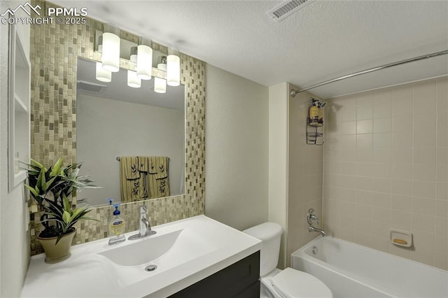 10641 Greenbelt Dr, Peyton, CO 80831 - full bathroom featuring toilet, vanity, washtub / shower combination, and a textured ceiling