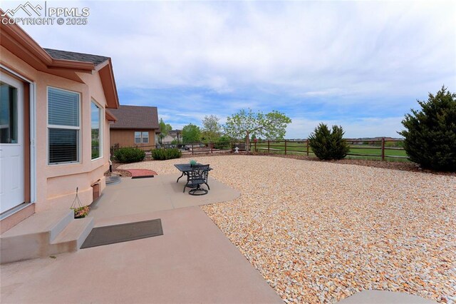 10641 Greenbelt Dr, Peyton, CO 80831 - fenced backyard featuring a patio area