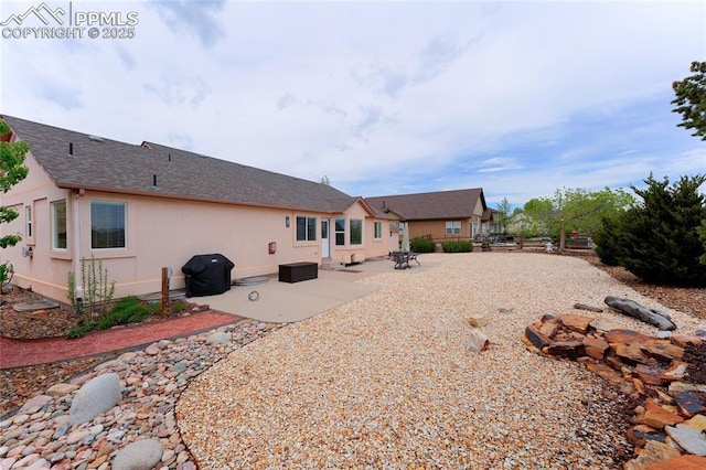10641 Greenbelt Dr, Peyton, CO 80831 - back of property with stucco siding and a patio