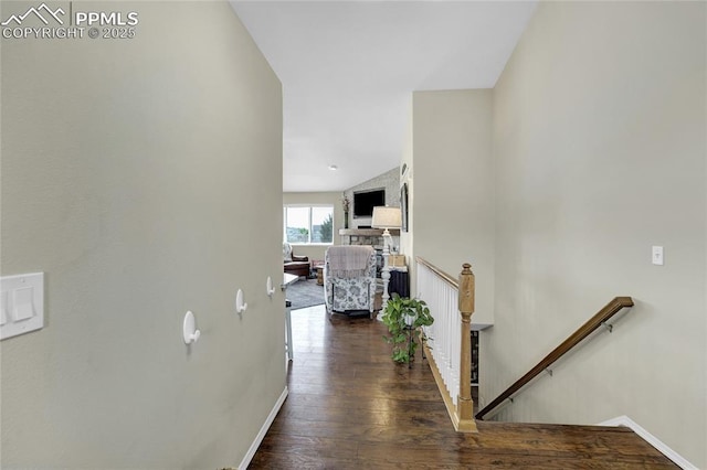 10641 Greenbelt Dr, Peyton, CO 80831 - hallway featuring an upstairs landing, baseboards, and wood finished floors
