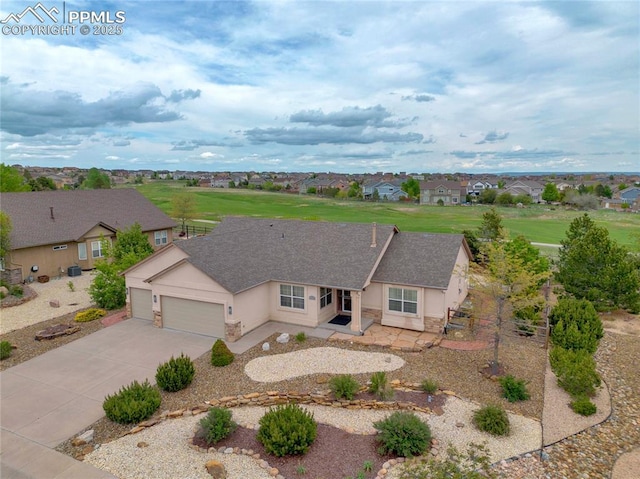 10641 Greenbelt Dr, Peyton, CO 80831 - single story home featuring an attached garage, a residential view, driveway, and stucco siding
