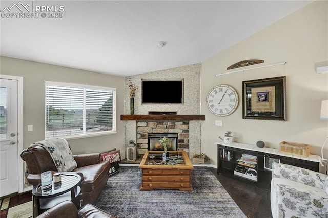 10641 Greenbelt Dr, Peyton, CO 80831 - living room with vaulted ceiling, wood finished floors, a fireplace, and baseboards