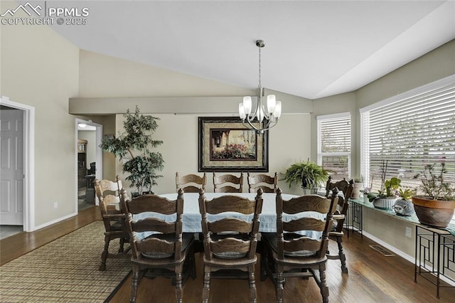 10641 Greenbelt Dr, Peyton, CO 80831 - dining room featuring lofted ceiling, wood finished floors, a chandelier, and baseboards