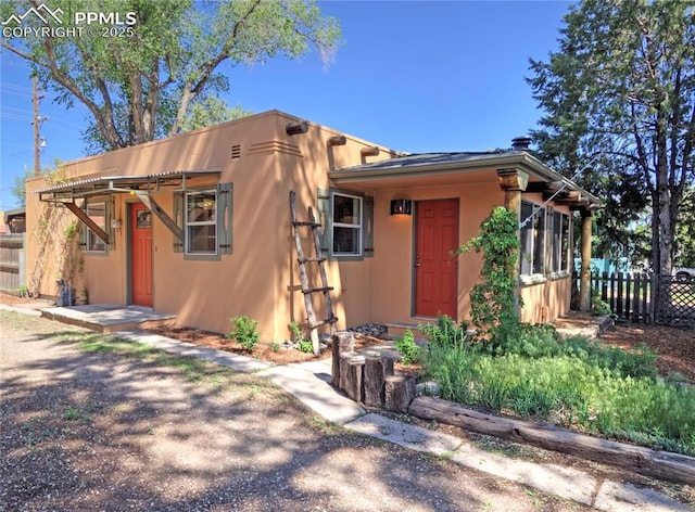 20 Swope Ave, Colorado Springs, CO 80909 - view of front of house with stucco siding