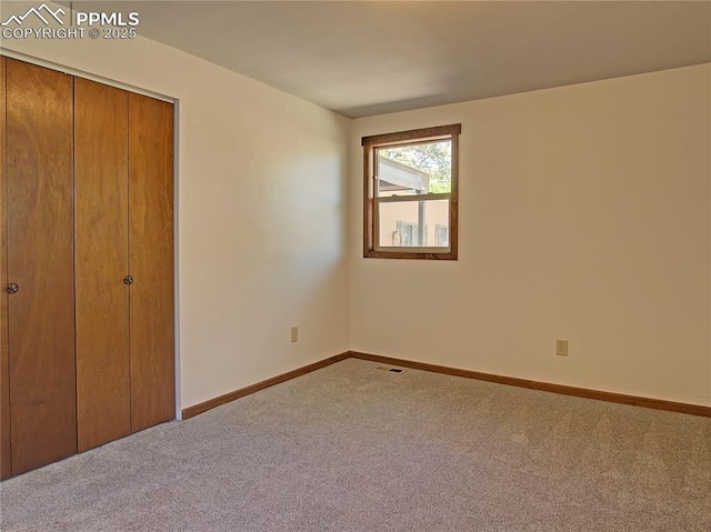 20 Swope Ave, Colorado Springs, CO 80909 - unfurnished bedroom with carpet flooring, baseboards, and a closet