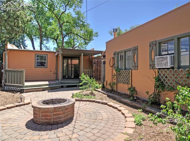 20 Swope Ave, Colorado Springs, CO 80909 - view of patio / terrace featuring a fire pit, a deck, and cooling unit