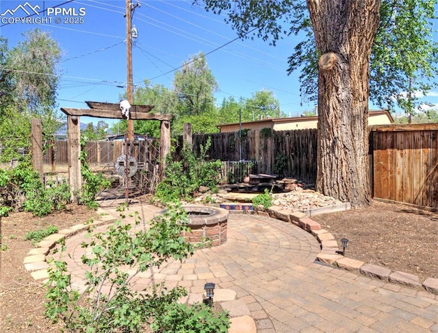 20 Swope Ave, Colorado Springs, CO 80909 - fenced backyard featuring a patio area and a fire pit