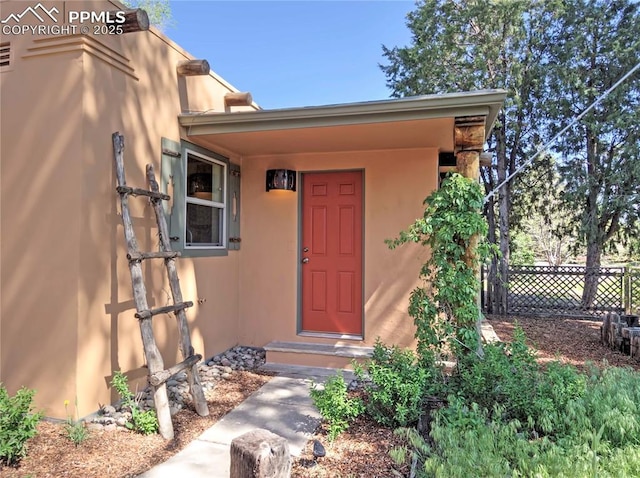 20 Swope Ave, Colorado Springs, CO 80909 - property entrance with stucco siding