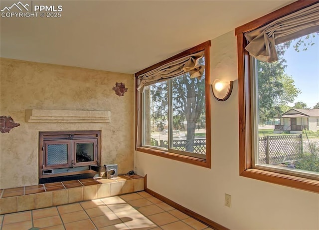 20 Swope Ave, Colorado Springs, CO 80909 - unfurnished living room with tile patterned flooring and baseboards