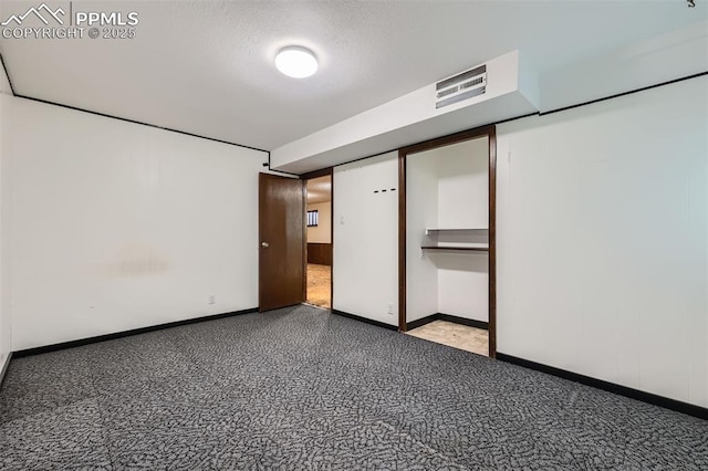 3286 Inspiration Dr, Colorado Springs, CO 80917 - unfurnished bedroom with carpet flooring, baseboards, and a textured ceiling